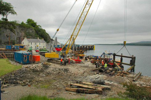 Picture of construction work on a small harbour on a sound between two islands
