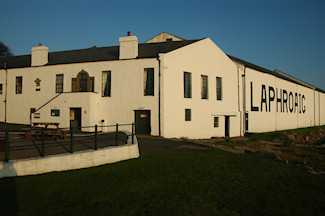 Picture of the Laphroaig distillery offices and the famous warehouse nr 1 in mild evening light