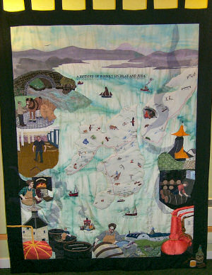 Picture of a quilt showing the history of whisky making on Islay and Jura