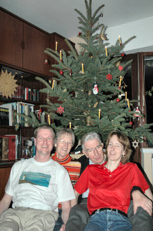 Picture of the Grewe family in front of their Christmas tree
