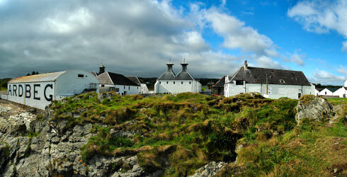 Picture of a panoramic view over a distillery (Ardbeg) in the late afternoon sun