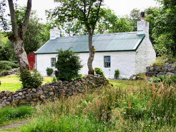 Picture of a cottage with a new green roof