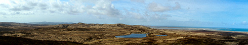 Panoramic view over a wide landscape with two sea lochs