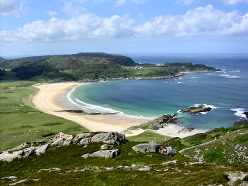 Picture of a beautiful sandy bay, seen from a hill above