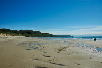 Picture of a beautiful golden sandy beach in a large bay