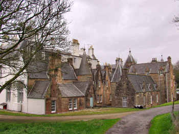Picture of the back of a large house, mainly unpainted sandstone (Islay House, Islay)