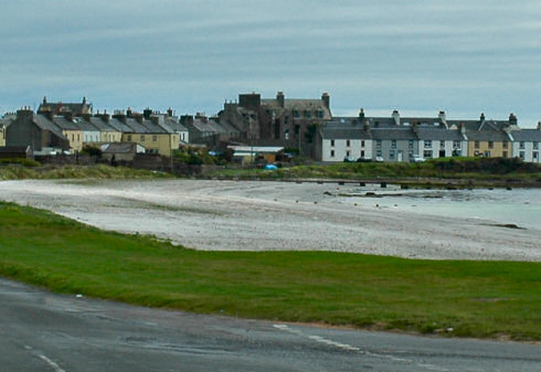 Picture of a coastal village with the same building as mentioned above still standing