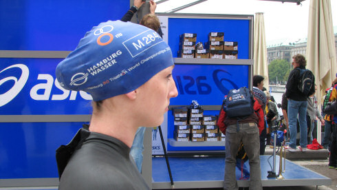 Picture of a young woman (Mhairi Muir) with a swimming cap, just before the start to a race