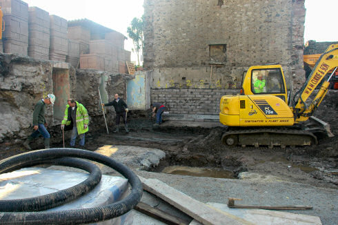 Picture of old foundations and walls being removed