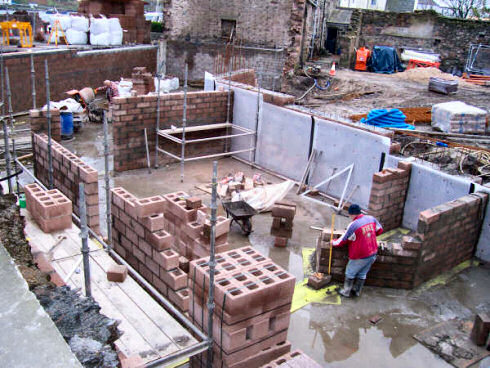 Picture of a building site, the basement of a larger building under construction