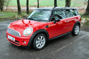 Picture of a Mini Clubman, red with black roof