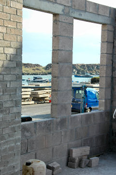 Picture of a view through window holes to a harbour