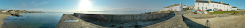 Picture of a panoramic view over a sea loch from a concrete pier, taken on a beautiful sunny April morning
