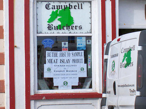 Picture of a butchers premises with the butchers van parked outside