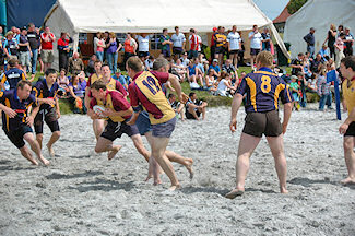 Picture of beach rugby in full action