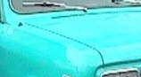 Picture of a car painted in some kind of turquoise