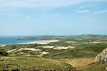 Picture of dunes and machair around a wide bay