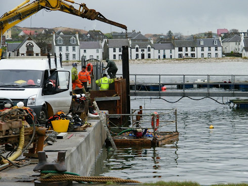Large picture of workmen busy on a quay wall