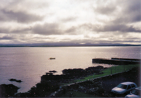 Scan of a picture of a view over a sea loch