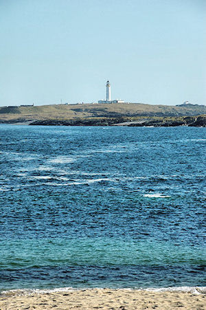 Picture of a lighthouse seen from a beach
