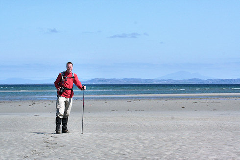 Picture of a walker on a wide beach