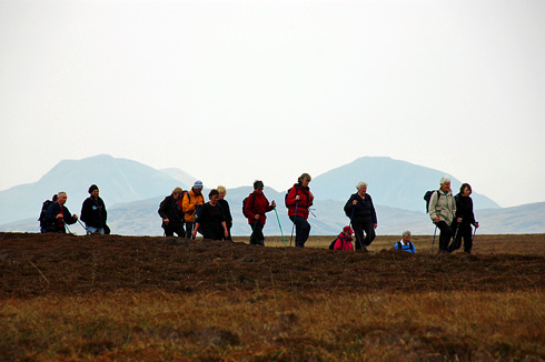 Picture of walkers in a wild landscape, hills in the background