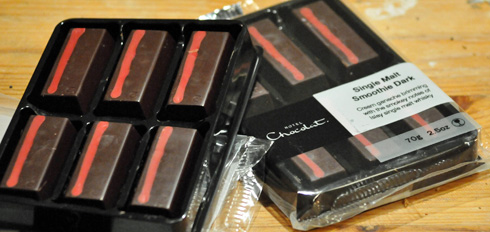 Picture of two packs of Hotel Chocolat whisky chocolate, one opened