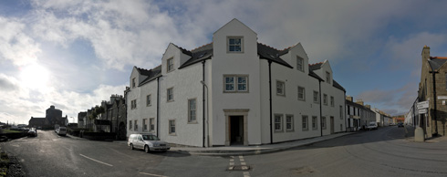 Panoramic picture of an under construction hotel, all walls now painted