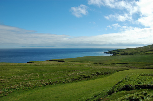 Picture of a view across a wide channel to another island