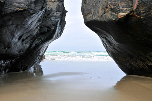 Picture of a collapsed natural above a sandy ground