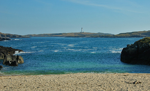 Picture of a view from a beach over two other islands