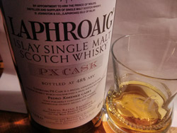 Small picture of a bottle of Laphroaig PX cask with a wee dram next to it