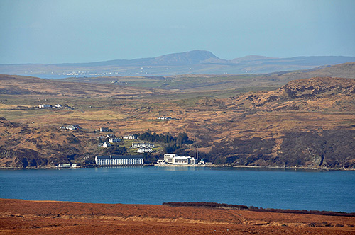 Picture of a view from an island across a sound to another island with two villages visible