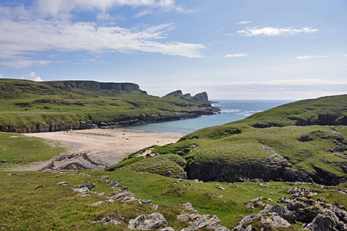 Picture of a view of a small remote beach in a wild landscape
