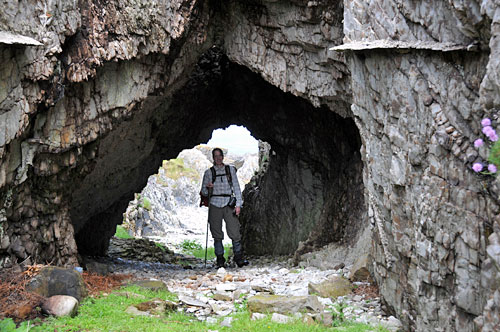 Picture of a woman standing in a natural arch