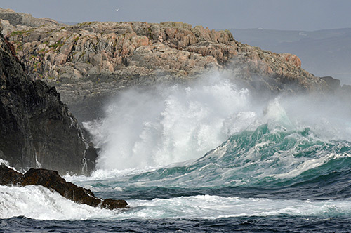 Picture of large waves breaking over rocks