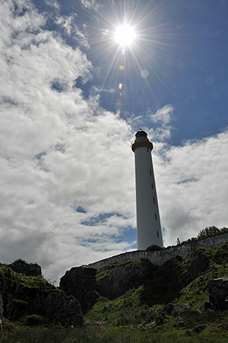 Picture of a lighthouse under the bright midday sun